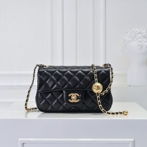 CHANEL Black and Gold Quilted Shoulder Bag